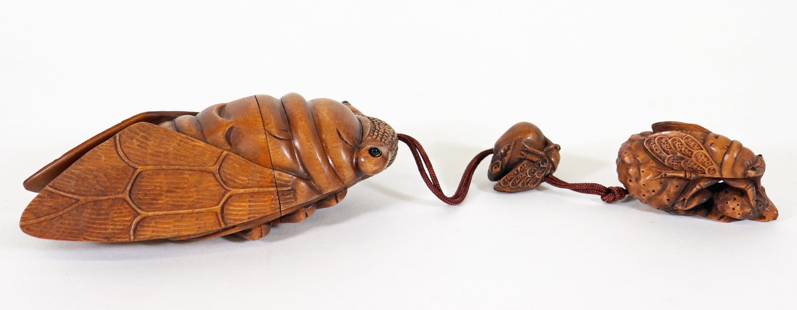 JAPANESE WOOD CICADA INRO NETSUKE: Japanese signed carved wood Inro Netsuke with three carvings of cicada insects. Largest 4.25".
