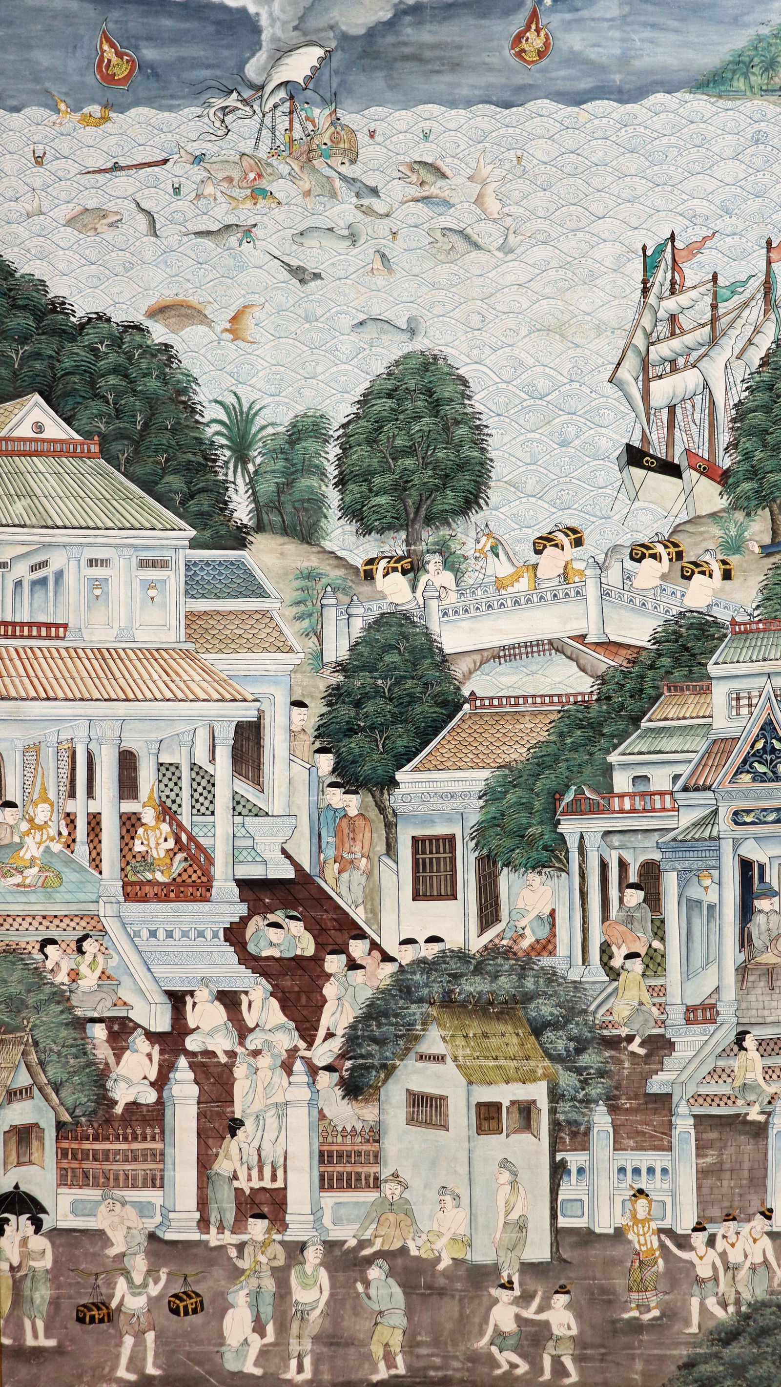 THAI VILLAGE NARRATIVE PAINTING MURAL ART: Large vertical Thai hand painted cloth painting, late 19th or early 20th century, believed to be silk, depicting a village scene with the sea, fish, sailing vessel, and clouds above the village with h