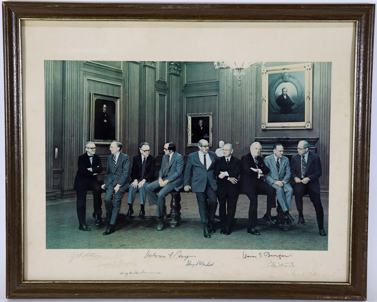 RARE 1977 SUPREME COURT SIGNED PHOTO: A color photograph of the 1977 United States Supreme Court, commonly known as the Burger Court, led by Chief Justice Warren E. Burger. Believed to be the first casual photograph taken of all nine just