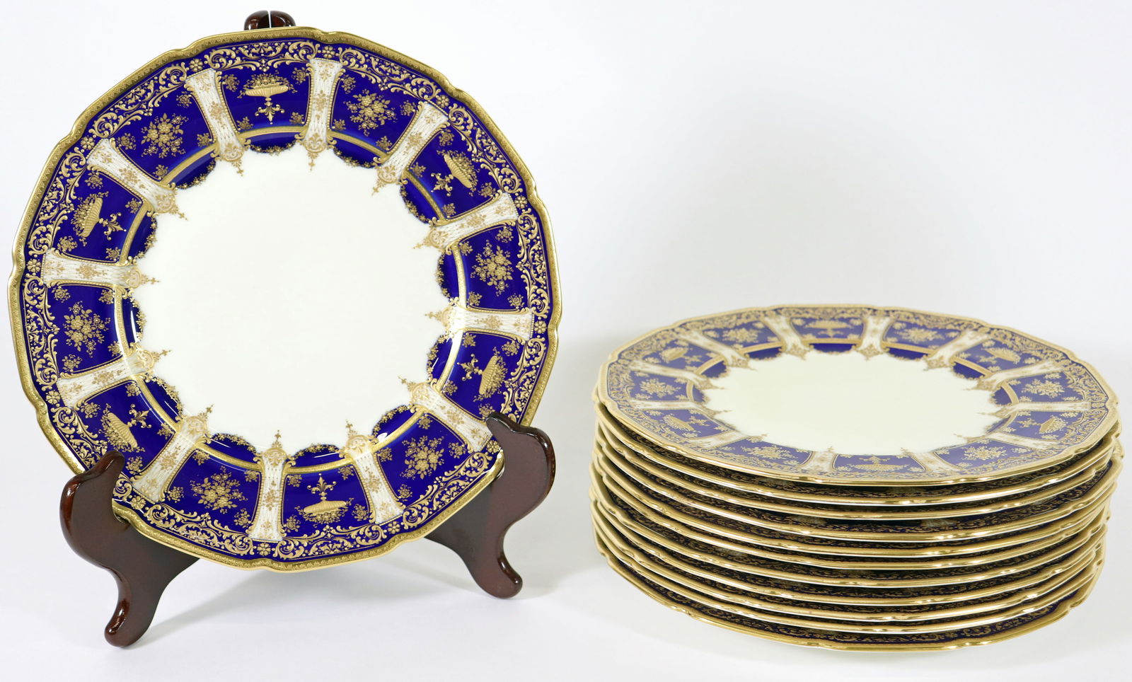 (12) ROYAL DOULTON COBALT BLUE & GOLD PLATES: Set of (12) Royal Doulton cobalt blue and gold plates. 10 3/8" wide. Numbered on bottom RA 8772 H 625.