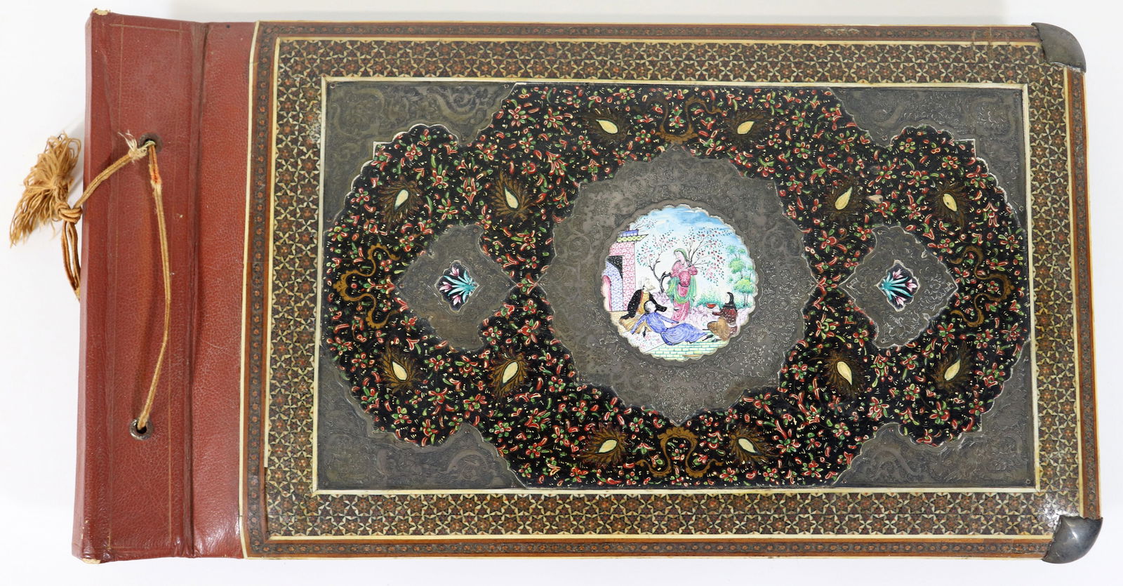 PERSIAN INLAID BOOK - SHAH MOHAMMAD REZA PAHLAVI: This stunning photo album / scrap book was presented by the Shah of Iran, Mohammad Reza Pahlavi to Lieutenant Colonel Joseph E. Gary in recognition of his valuable service and outstanding