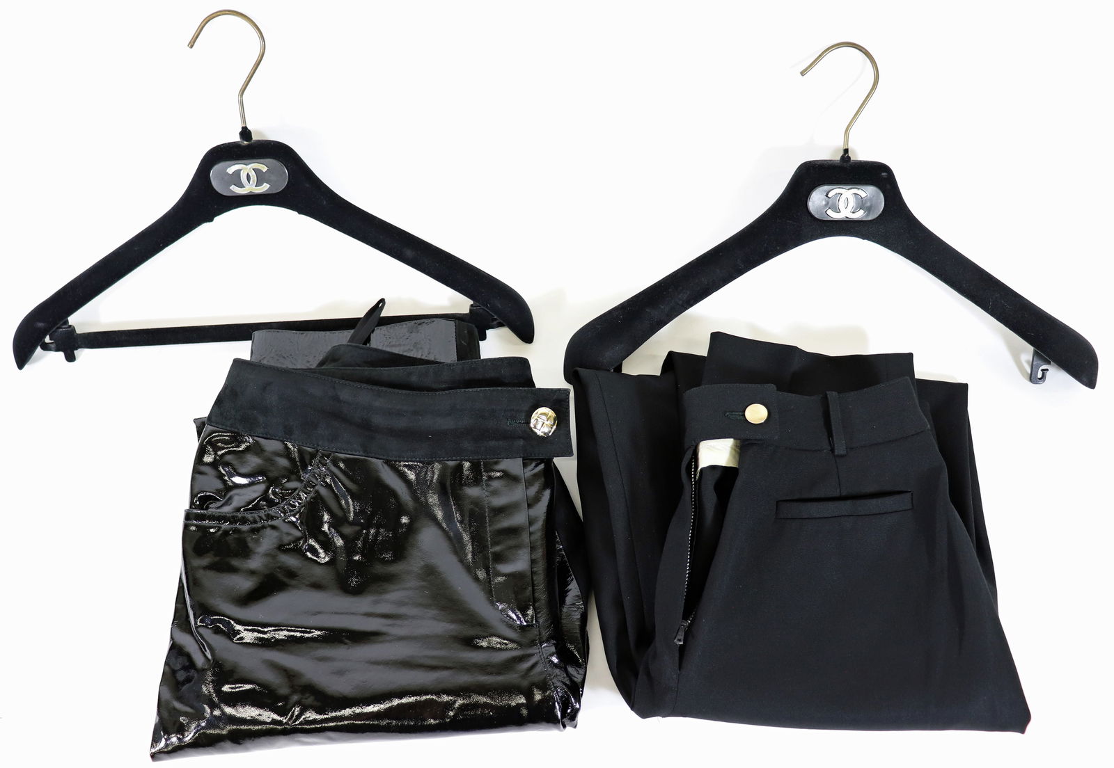 (2) PAIRS OF VINTAGE CHANEL PANTS: Includes a pair of lambskin / calfskin black pants in a size 42. The Chanel tag reads 01A P18470W02860 94305 42. A second tag reads 100% lambskin 100% Calfskin and 100% silk. They are 42" long. The ot