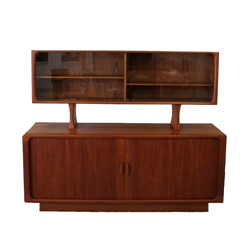 MID CENTURY MODERN DYRLUND DANISH SIDEBOARD: Two piece teak sideboard cabinet. Top has two shelves and sliding glass doors. Bottom has two sliding doors with shelves and pull out drawers in middle. Measures 61" tall 75" x 19" wide.