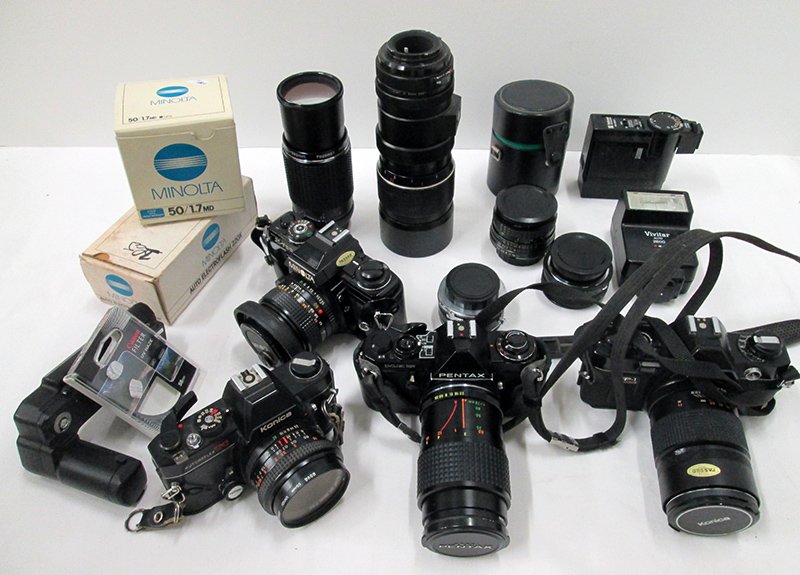 PENTAX, MINOLTA, & MORE CAMERA COLLECTION: Large lot of cameras including a Pentax ME Super with Vivitar 52mm skylight lens, a Konica Auto Flex TX with Hexas AR 28mm lens, a Minolta X-700 with Minolta MD 50mm 1:1.4 lens, a Konica Haxanon AR le