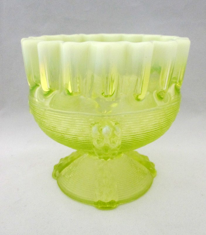 VASELINE GLASS COMPOTE: Opalescent ruffled rim. 4 1/2" tall and 4 1/2" wide.