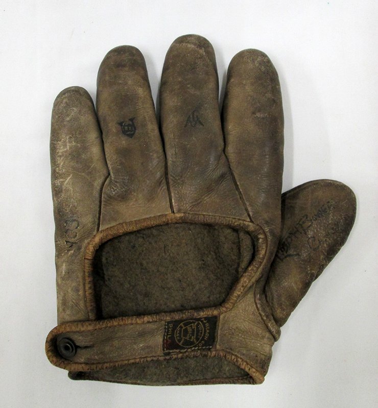 ANTIQUE A.J. REACH BASEBALL GLOVE: Late 19th or early 20th century AJ Reach baseball glove. This rare glove is pre-web, probably created before the turn of the century. The glove has original AJ Reach Co. tag. There is some writing on 