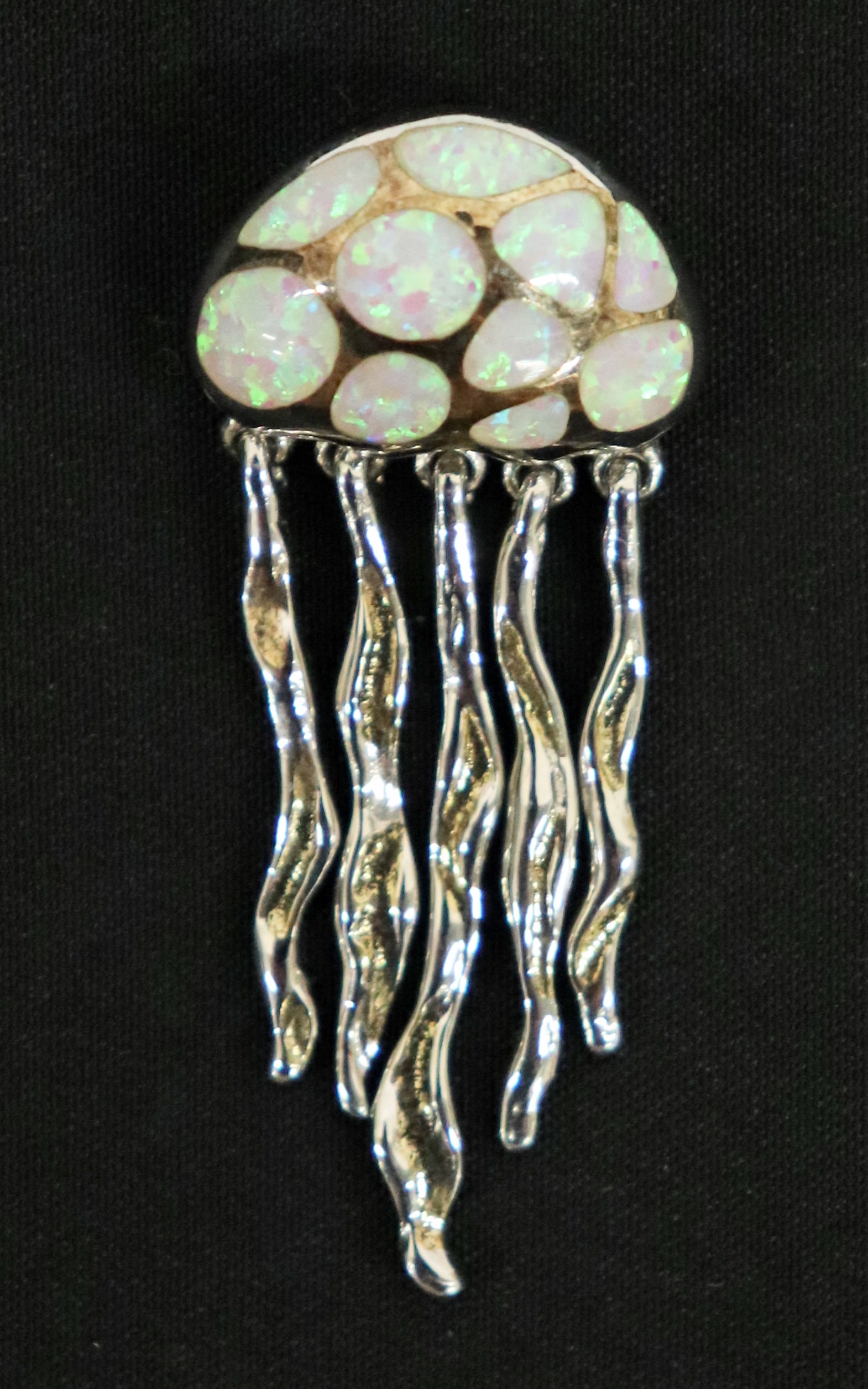 STERLING SILVER & MOSAIC OPAL JELLYFISH PENDANT: Sterling silver Jellyfish pendant with mosaic opals and movable tentacles. Measures 1.75" long.