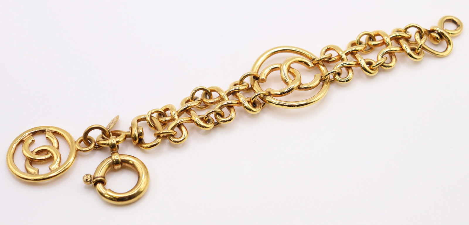 VINTAGE CHANEL CC CHARM BRACELET W/ BOX: A Chanel gold plated charm bracelet from the 1993 Karl Lagerfeld collection. Chanel 93CCP. 7" long and 1.25" wide. Purchased from The Real Real 6/16/24. Estimated Retail Value $1,200.