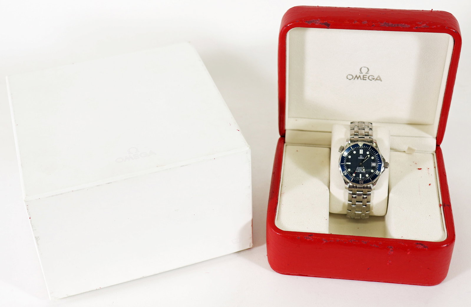 OMEGA SEAMASTER DIVER WRISTWATCH WITH BOX: Omega Seamaster Diver 300M Professional Chronometer 300m / 1000 ft. Blue wave dial. 36mm. Comes with the original box and warranty cards. Fits a 9" wrist. Manual wind. It is running. Ref 2551.80.00