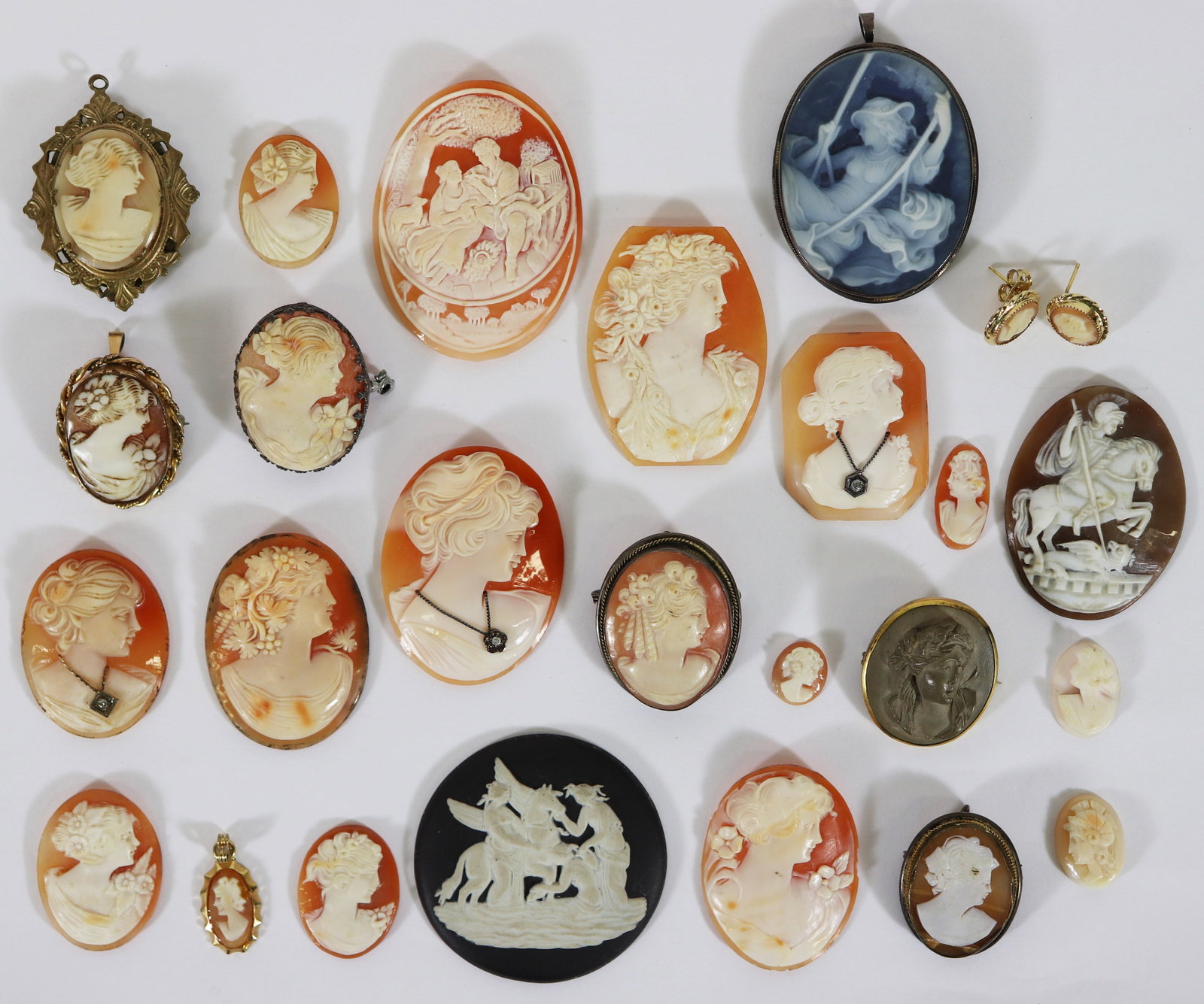 (25) ANTIQUE / VINTAGE VICTORIAN CAMEO COLLECTION: A collection of old cameo's to include a lava cameo, a cameo locket, habille diamond cameos, a black jasperware Wedgwood cameo, earrings, pendants, gold filled, 800 silver and more. They range in size