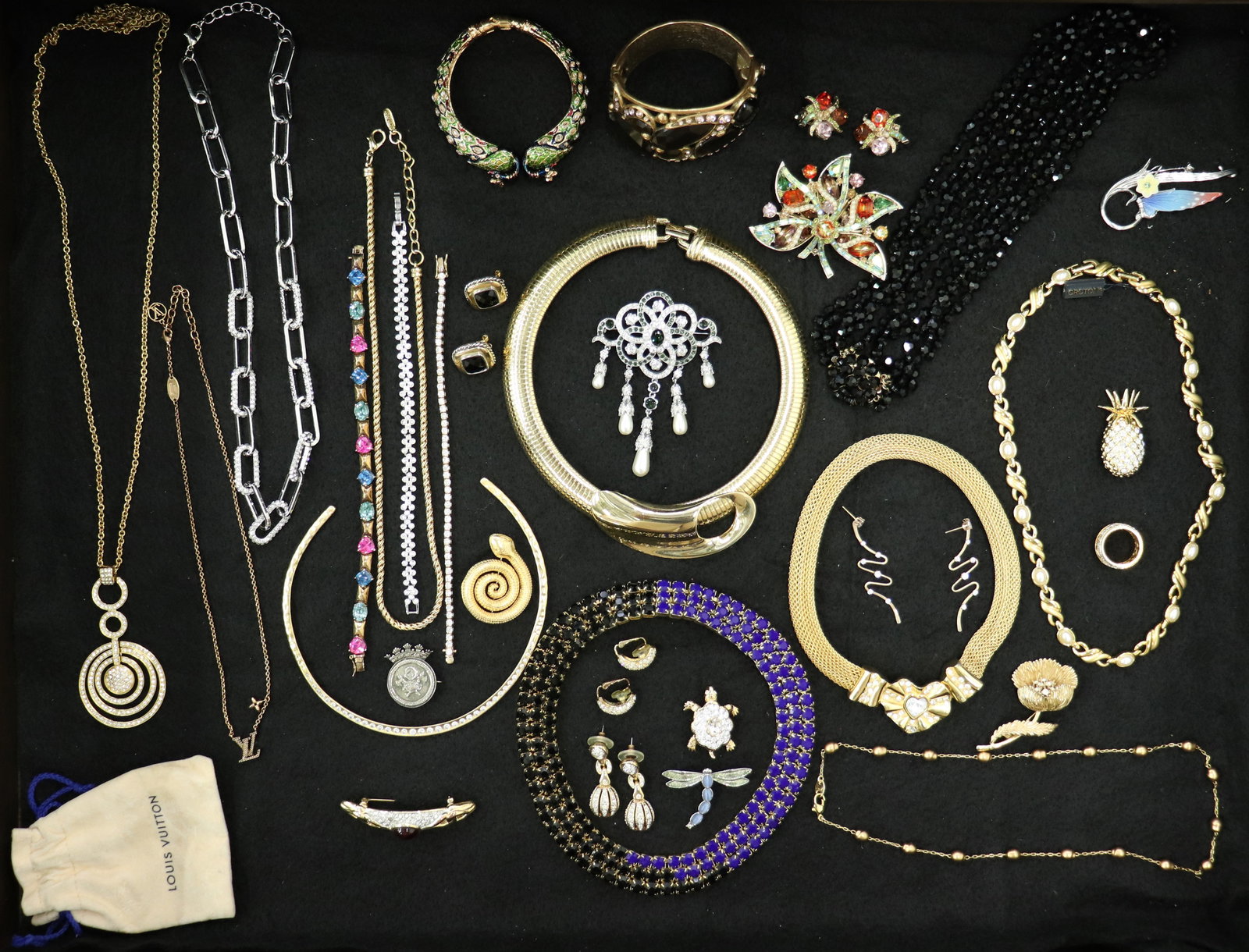 VINTAGE DESIGNER COSTUME JEWELRY COLLECTION: A collection of costume jewelry to include Nettie Rosenstein sterling, Givenchy, Louis Vuitton, Oscar De Le Renta, Trifari, Voghue, Hollycraft 1957, Franz, Kendra Scott, Christian Dior, Joan Rivers, D