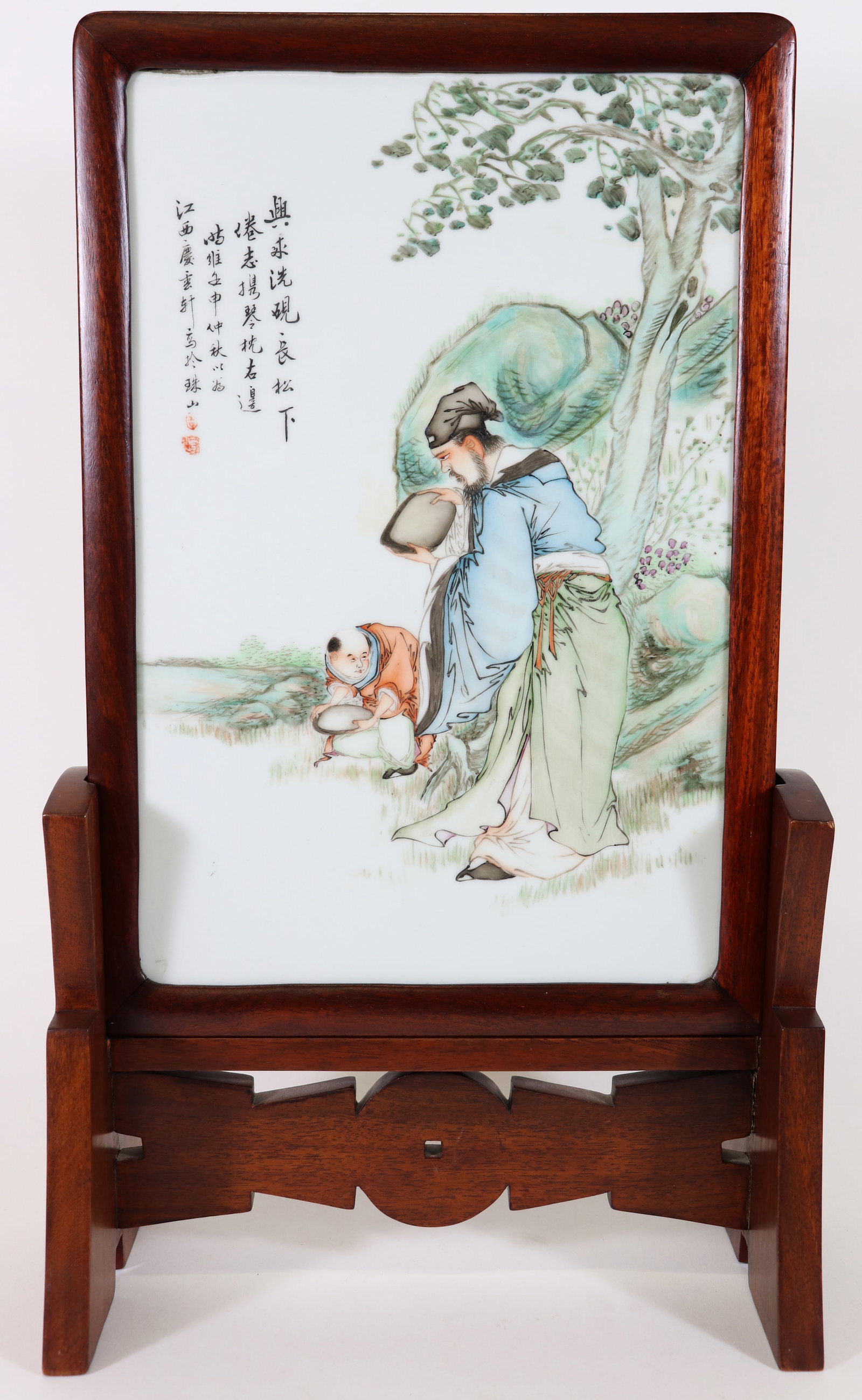CHINESE FAMILLE ROSE PORCELAIN PLAQUE WITH STAND: Wood framed hand painted Chinese porcelain plaque / table screen with a seal in the style of the "Eight Friends of Zhushan" by Wang Qi. Measures 14.5 x 9,5" (plaque only) and measurements in stand: 21