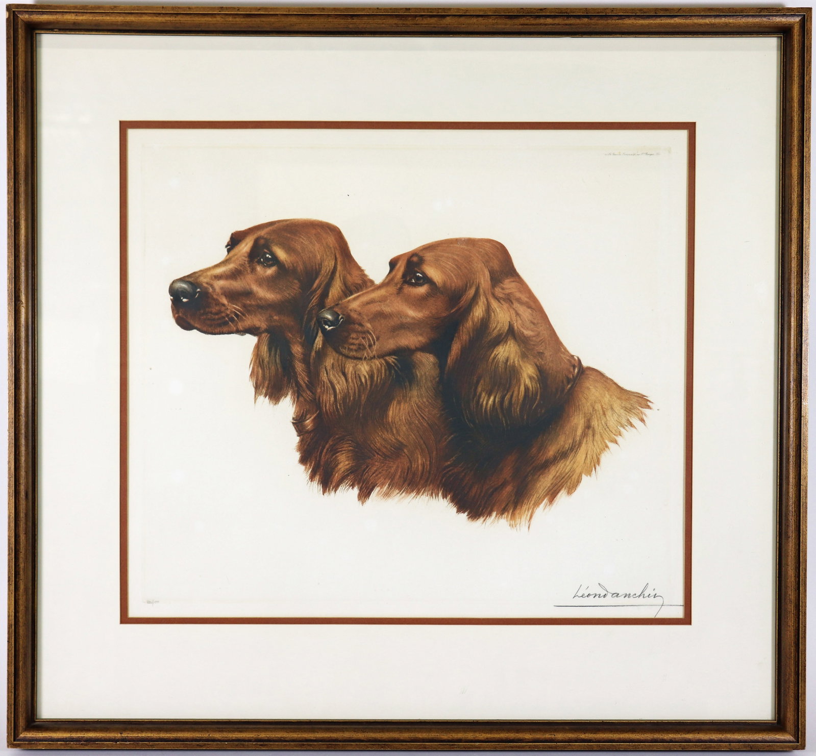 LEON DANCHIN PAIR OF IRISH SETTERS DOG ETCHING: Leon Danchin (French 1887 - 1938) Color etching of a pair of Irish Setter dogs, their profiles facing left. Pencil signed lower right and numbered 282/500. Image measures 16 1/2" x 19", framed with gl