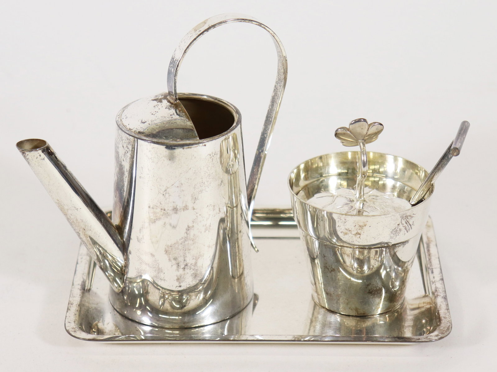 TIFFANY & CO MAKERS STERLING GARDEN FLOWER POT SET: A Tiffany & Co Makers sterling silver creamer and sugar set with tray. The tray is marked Tiffany & Co Makers Sterling Silver 23852 (6" x 4.5") with a Tiffany & Co sterling watering can and flower buc