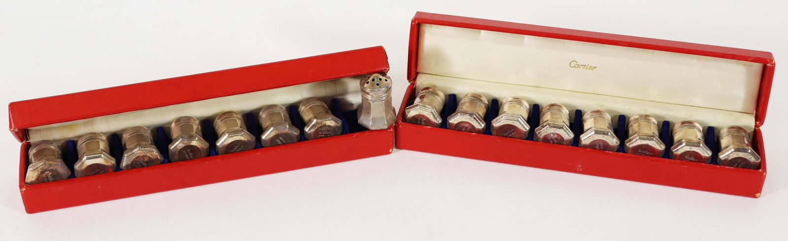 (16) CARTIER STERLING SILVER SALT & PEPPER SHAKERS: Two boxed sets of Cartier sterling silver salt and pepper shakers. Total weight 3.66 troy oz. Shakers 1.5" tall.