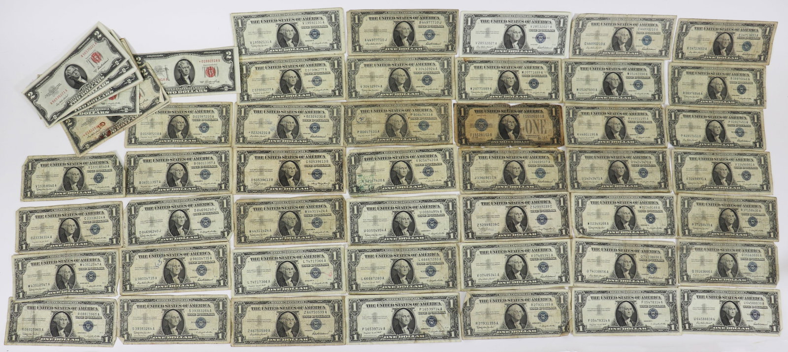 44 $1 SILVER CERTIFICATES & 20 $2 RED SEAL DOLLARS: A collection of old US dollars to include (44) $1 Silver Certificates 1928,1935, 1938 and 1957 Also includes (20) $2 Red Note dollar bills with dates 1928, 1953 and 1963.