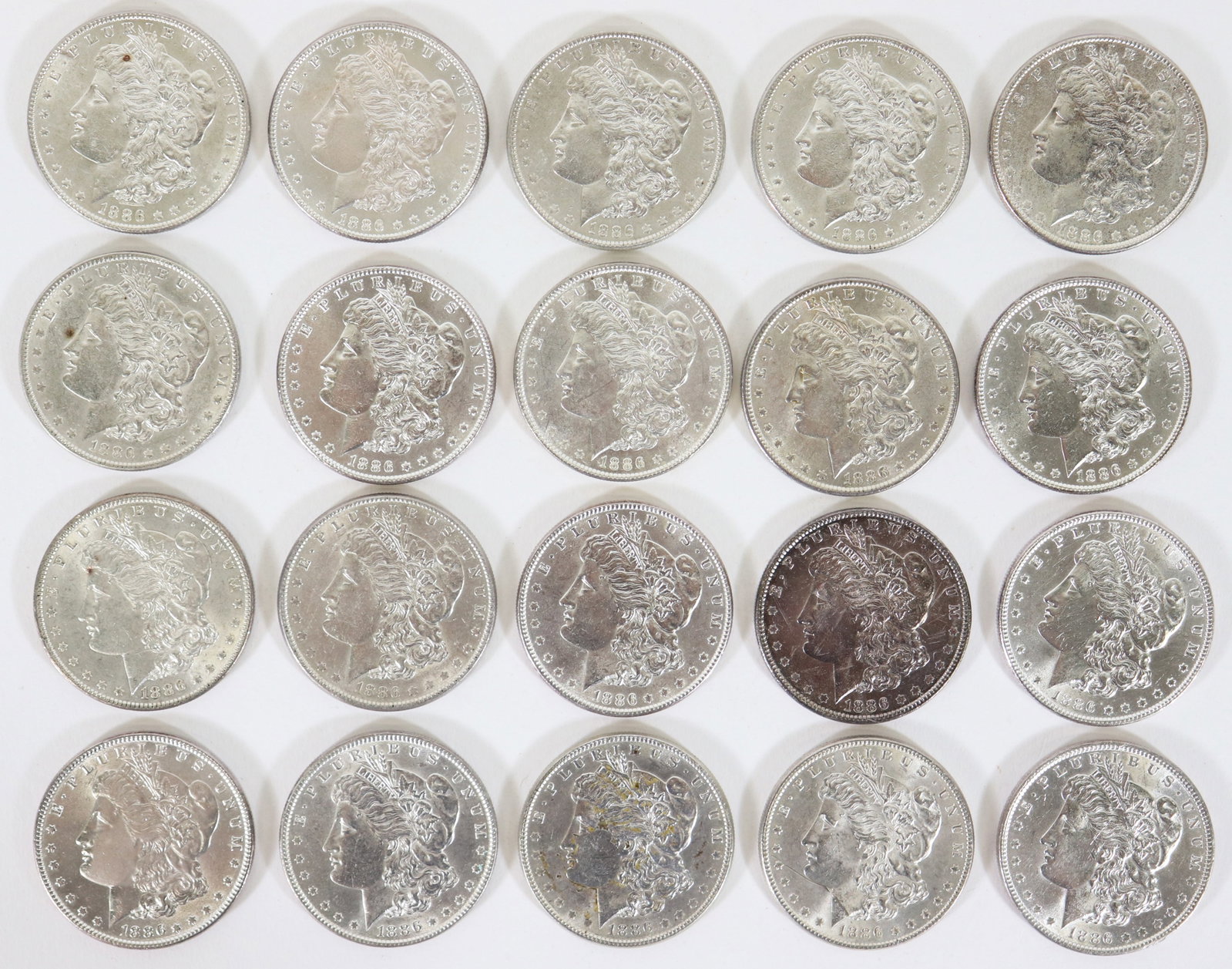 (20) 1886 MORGAN SILVER DOLLAR COINS: Collection of (20) 1886 Morgan silver dollar coins in AU - MS condition.