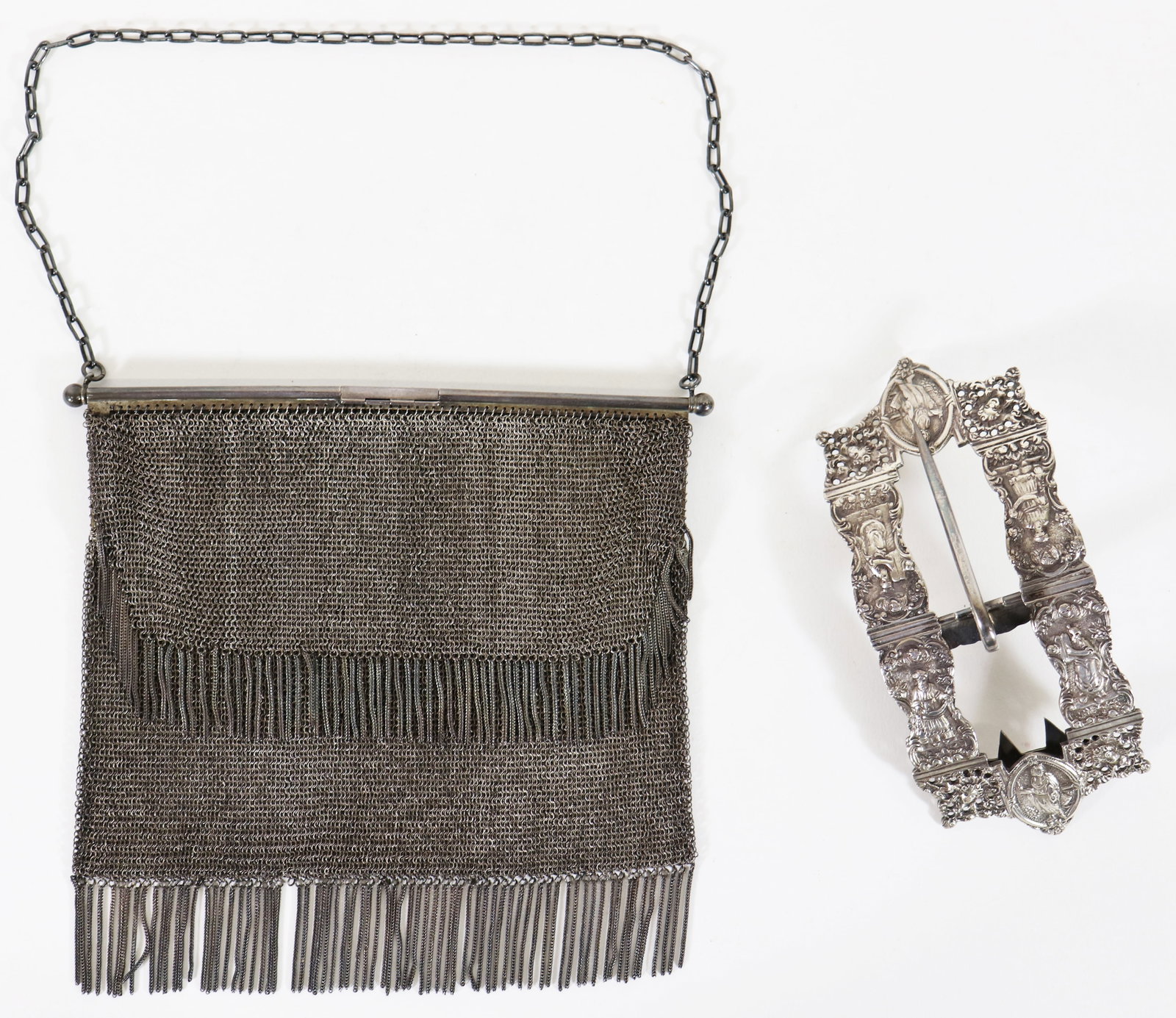 ANTIQUE STERLING SILVER PURSE & BELT BUCKLE: Art Deco era evening bag with a double tiered tassel and a link chain. The frame is engraved with scripted initials and the date 1916 and marked sterling silver Germany. Measures approximately 7" x 7 