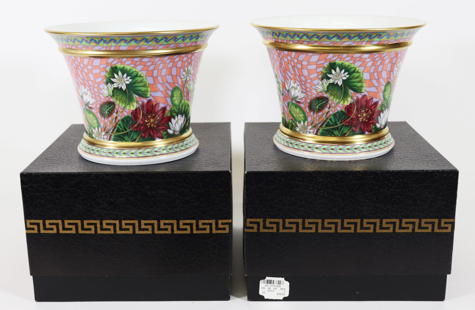ROSENTHAL VERSACE TROPICAL WONDERLAND VASES 5.75": Two Rosenthal Versace Tropical Wonderland cachepot vases. 5.75" tall 7.5" wide. Includes original boxes, both with plastic wrap.