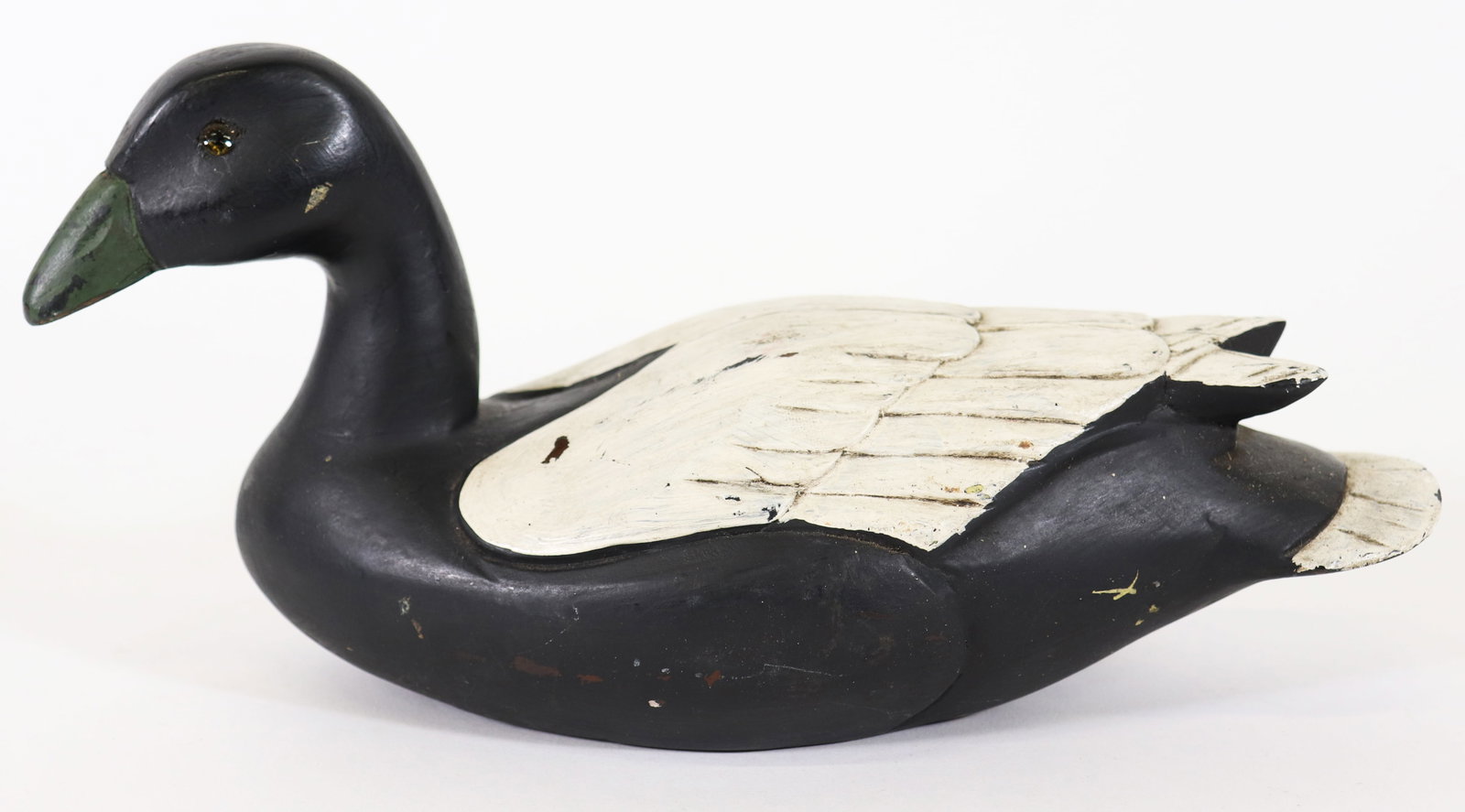 COBB EASTON MD WOOD DUCK DECOY: Painted carved wood duck decoy. Signed on the bottom TC Cobb Easton MD. Measures 13.25" long 6.25" tall.
