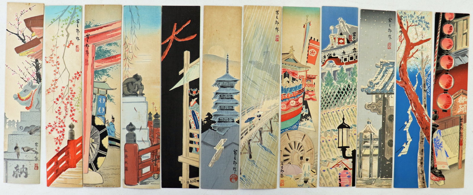 TOKURIKI TOMIKICHIRO - KYOTO TANZAKU TWELVE MONTHS: A collection of 12 Japanese woodblock prints published in 1939 (labels on verso). Each measures approximately 14.25" x 3"