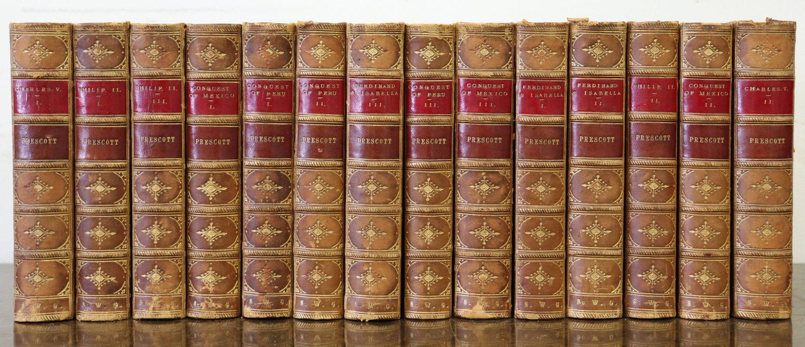 14 VOLUME WILLIAM H PRESCOTT HISTORICAL WORKS: A nice bound 14 book set of historical works by William H. Prescott. This set is comprised of Ferninand and Isabella The Catholic of Spain - Volume 1-3 printed in London by Routledge 1859-1870,