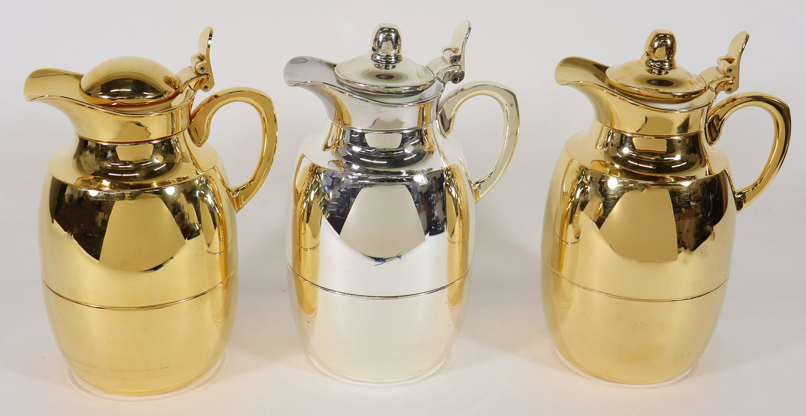 (3) ALFI GERMAN THERMAL INSULATED PITCHERS: Includes three pitchers made by Alfi in Germany, 1980's. Stainless steel and glass each measures 8 1/2 " x 5 1/2" x 4". These thermal jugs are known for their thermal insulation keeping coffee and tea