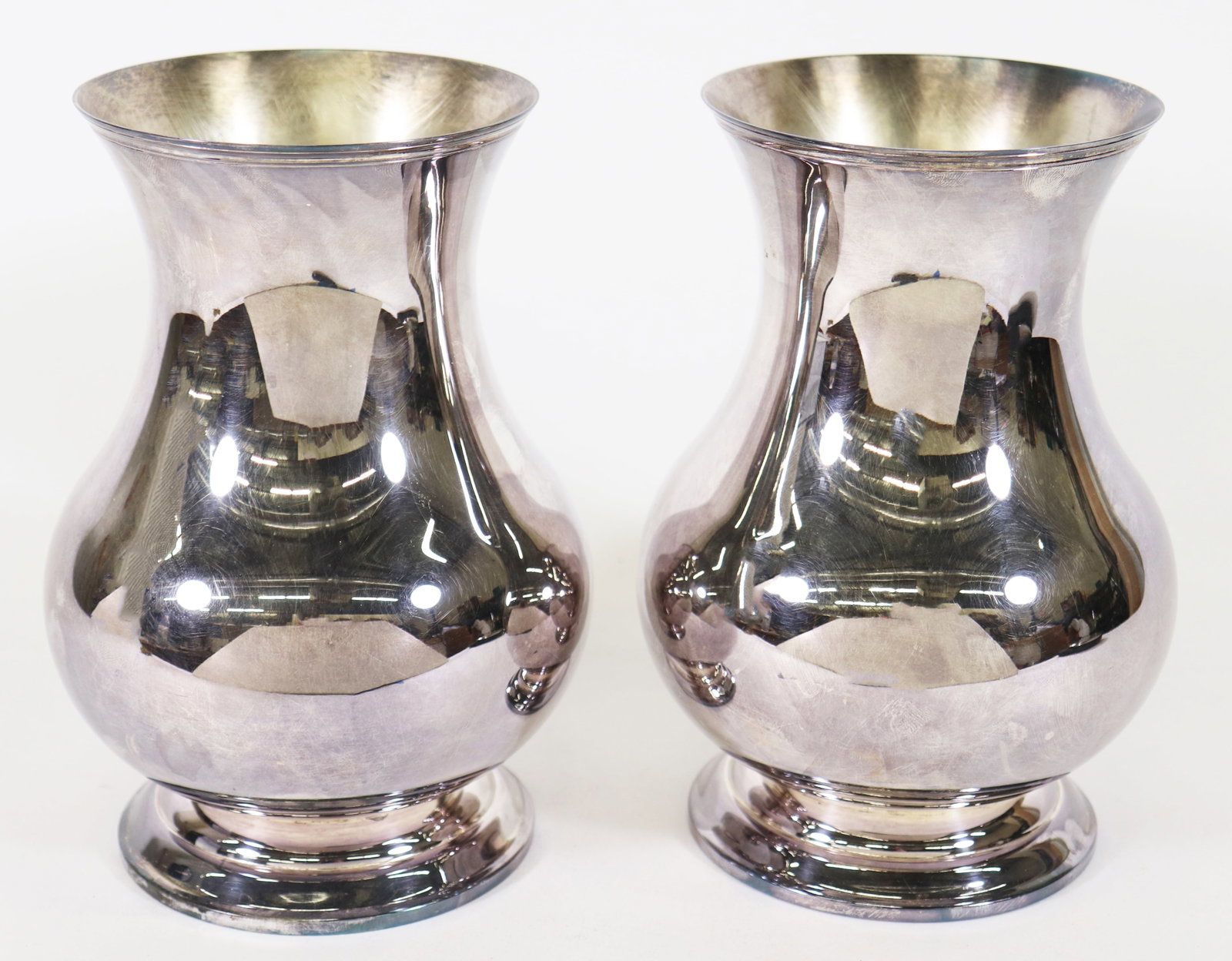 (2) CHRISTOFLE SILVERPLATE VASES: A pair of Christofle silver plate vases in the Uni pattern. 7 7/8" tall.