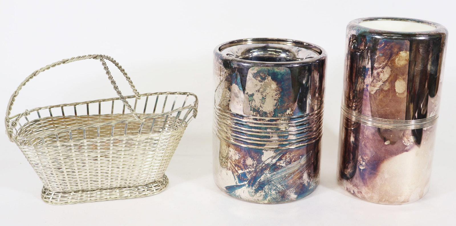 (3) CHRISTOFLE WINE POURER, WINE SLEEVE, CHAMPAGNE: Includes one vintage Christofle basket weave wine pourer, measures 8" x 9 3/4" x3 1/2", one insulated Christofle wine sleeve, measures 8 3/4" x 5" and one Christofle champagne cooler, measures 7 1/4"
