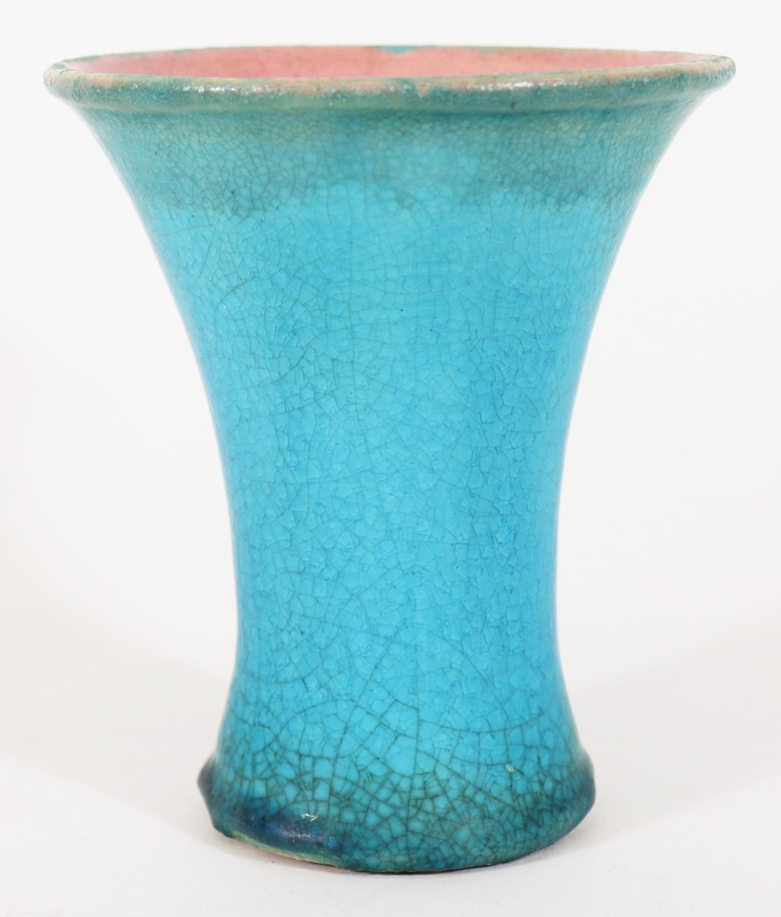 PISGAH FOREST TURQUOISE GLAZED POTTERY: A vintage Pisgah Forest Pottery (Arden North Carolina) trumpet vase with a crackled turquoise glaze and a pink glaze inside. Marked on base with the Pisgah Forest hallmark. 6" x 5.25"