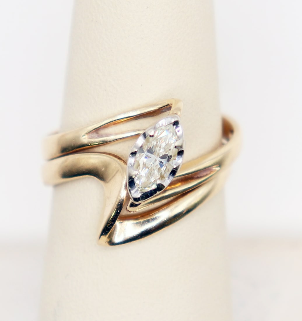 14K MARQUISE CUT DIAMOND MODERNIST RING & BAND: Vintage 14KT yellow gold ring with an approximate .40 carat marquise cut diamond in a Modernist setting with matching band. Total weight 3 grams, size 5.5-6.