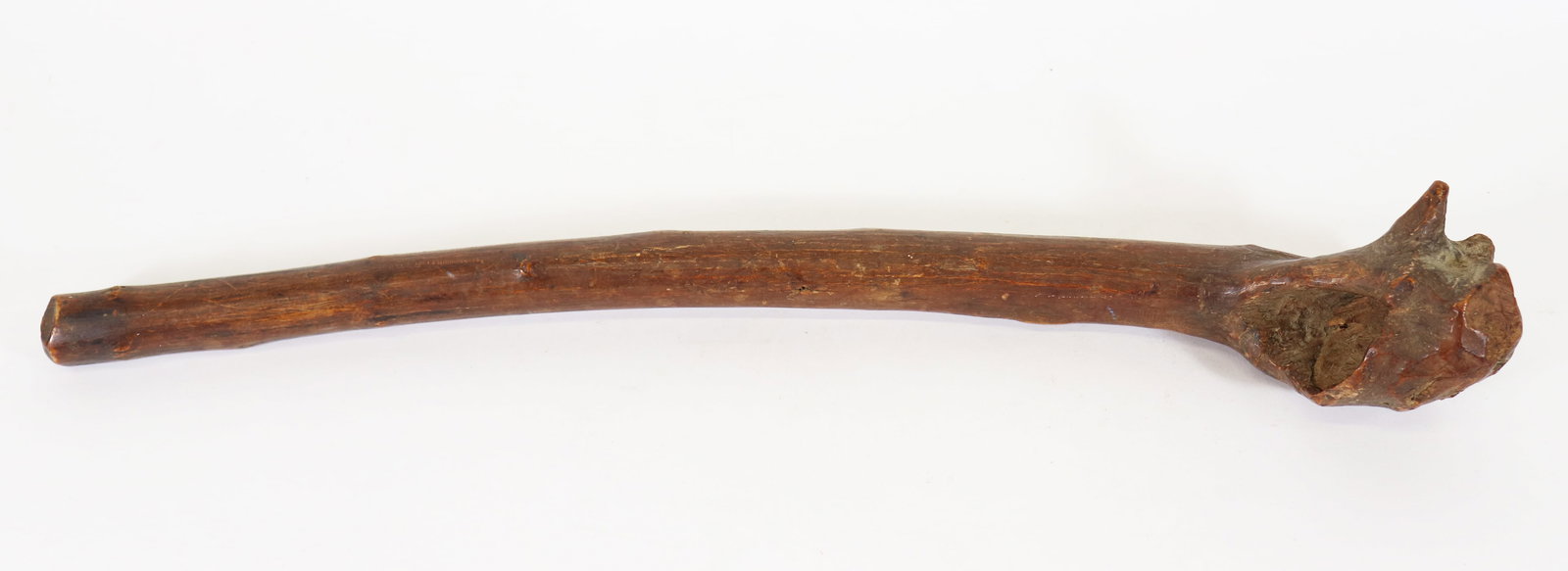 PENOBSCOT NATIVE AMERICAN WOOD WAR CLUB: Carved wood club, attributed to a Penobscot root war club, a traditional Native American impact weapon and folk art form crafted by the Penobscot Nation of Maine. Carved from the heavy root burl of sa