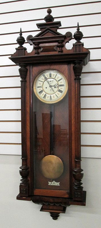 GUSTAV BECKER REGULATOR WALL CLOCK: Beautiful 19th century clock with roman numeral numbered face and GB with crown. Clock includes two weights and key. c1840's. Measures approximately 50" long 15 1/2" x 6" wide.
