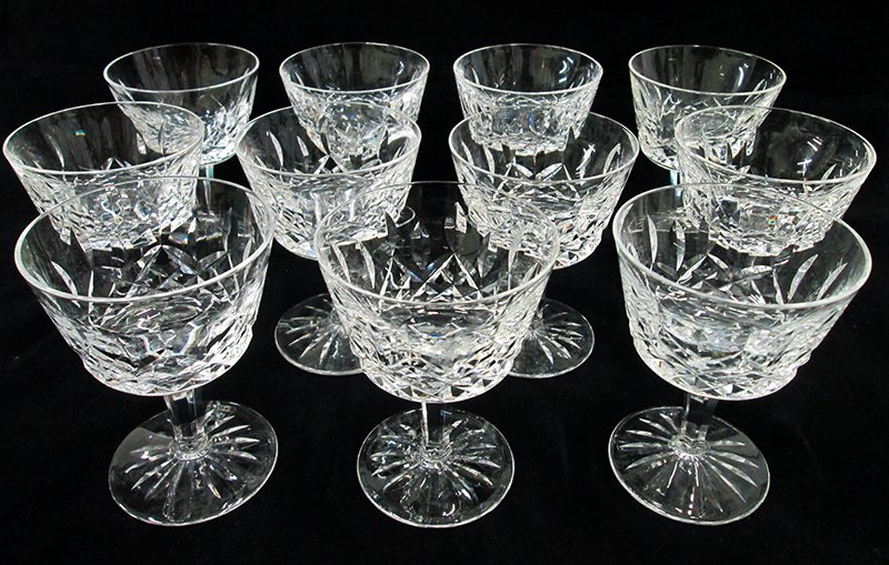 WATERFORD CRYSTAL LISMORE LIQUOR GLASSES: 11 matching liquor glasses with an older acid etched Waterford mark. 4 1/8" tall.