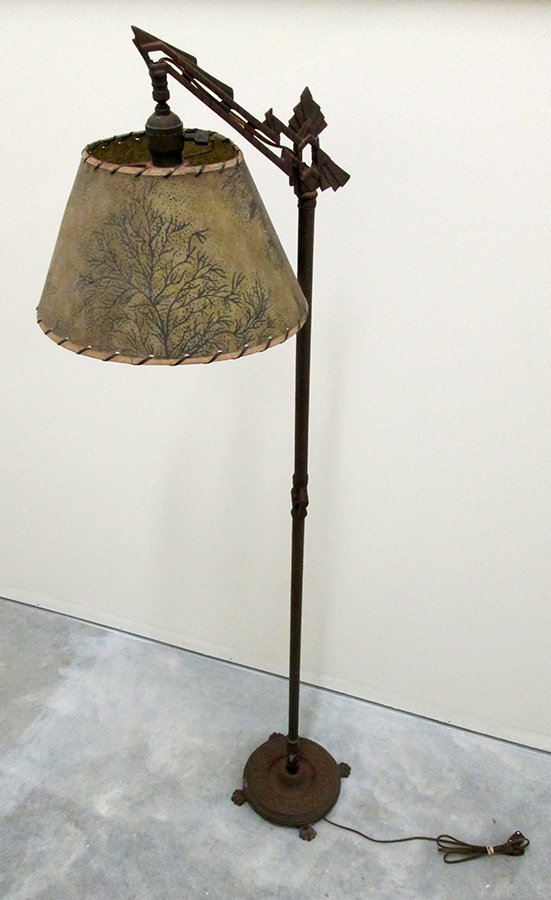 ART DECO ARCHITECTURAL FLOOR LAMP: c1920's Cast metal floor lamp with architectural design and inscribed flowers along shaft. Lamp stands 57" tall on a footed base and has a Bryant socket. Lamp is working.