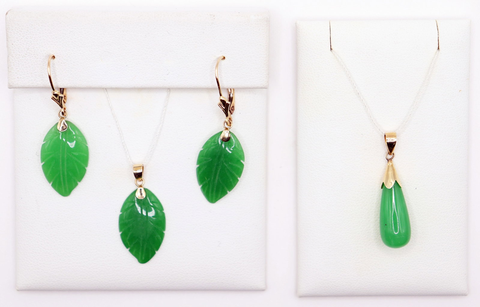 14K & GREEN JADE JEWELRY COLLECTION: 14K yellow gold and jade dangling pendant 1.25" long and matching set of 14K yellow gold and jade carved leaf design earrings and pendant.