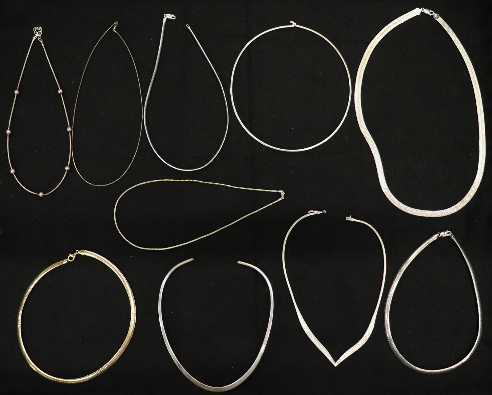 (10) STERLING SILVER NECKLACES: A collection of sterling silver necklaces in a variety of styles. All marked 925 or sterling. Total weight 183.2 g