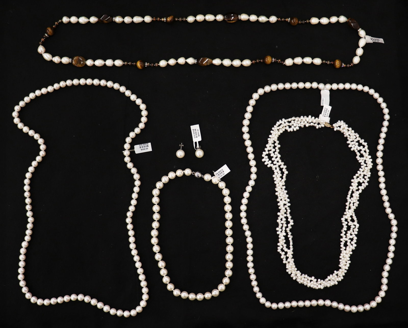 PEARL NECKLACE & EARRING JEWELRY COLLECTION: Collection of pearl jewelry including a pair of earrings set in 14KT white gold, (2) 36" strands, 17" necklace with magnetic ball clasp, 22" multi weave with 14KT yellow gold clasp, and a 36" tiger ey