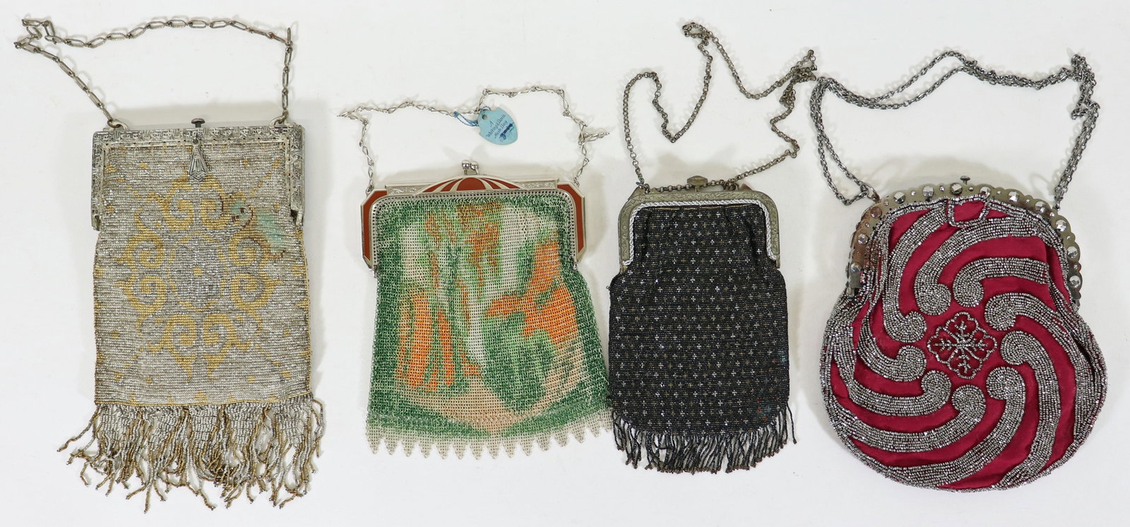 (4) ANTIQUE ART DECO MESH PURSES: A collection of vintage flapper girl Art Deco bags to include a new Whiting and Davis mesh purse with an enamel and silver frame with the original tag, a micro beaded mural bag with an "Import French 