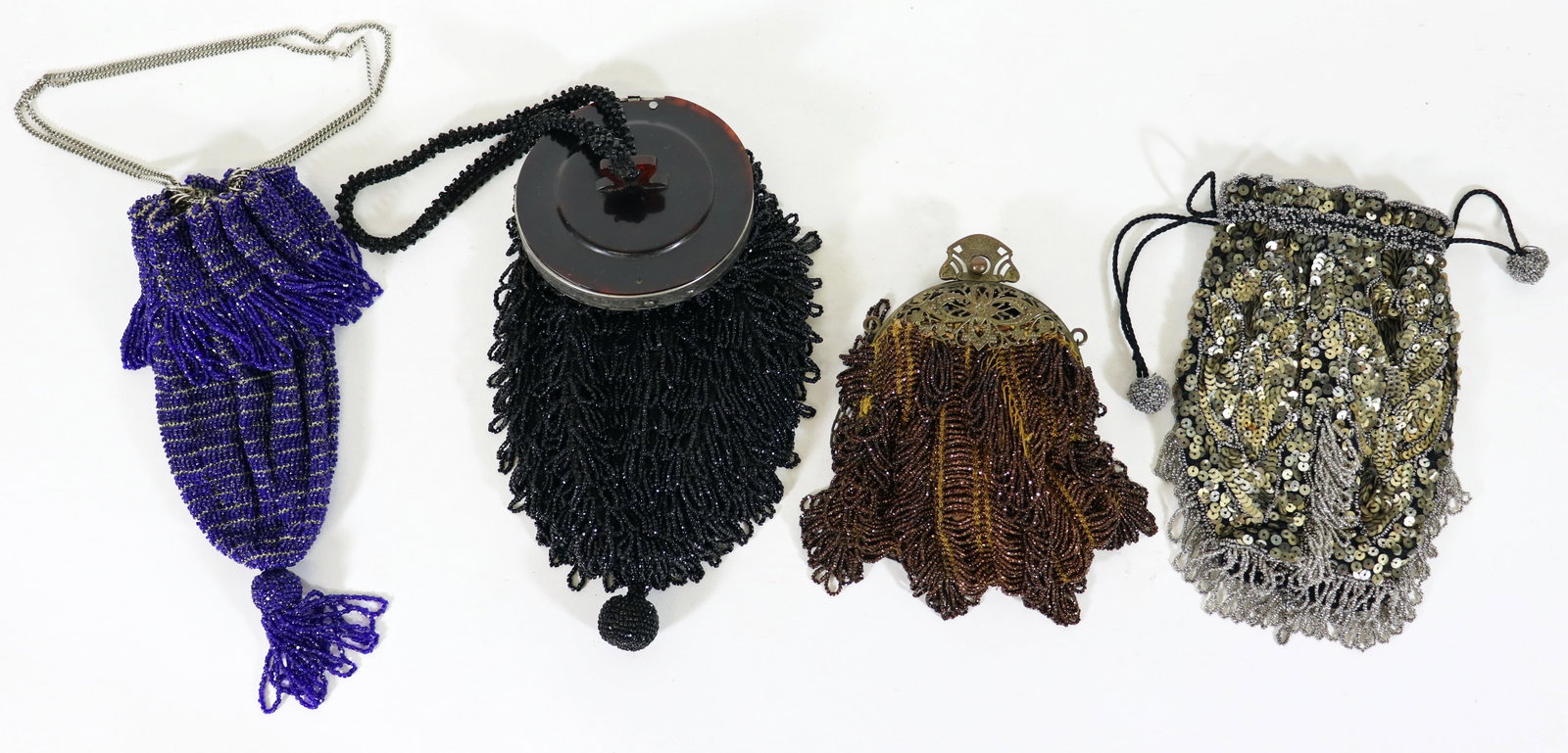 (4) VINTAGE 1920's FLAPPER GIRL PURSES: A collection of antique Art Deco flapper girl bags to include a black microbeaded purse with a silver rim and hanging tassel, a lapis blue micro beaded bag with a hanging tassel, a brass framed gold b