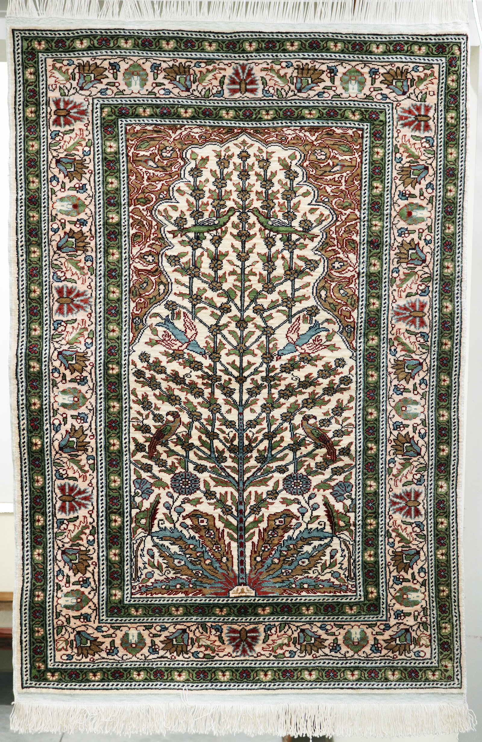 TURKISH SILK KAYSERI PRAYER RUG: A "Tree of Life" silk prayer rug that was purchased in Turkey in 2005 for $2,544. This was hung on a wall and was never walked on. Measures 3' 5" x 2' 4"