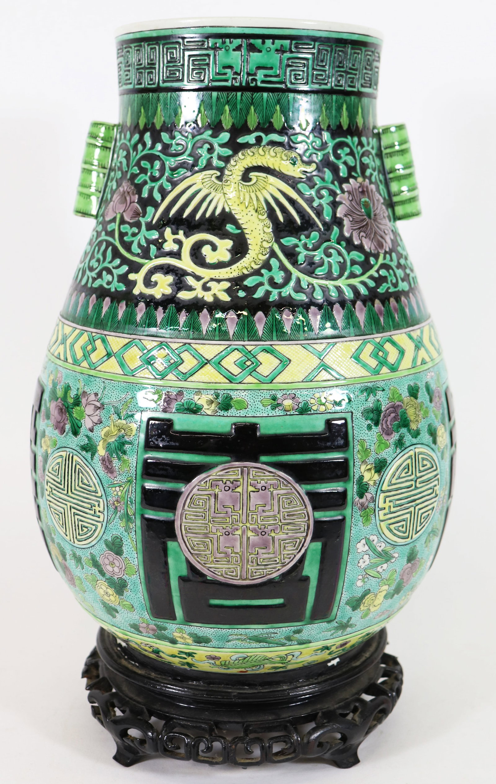CHINESE PORCELAIN JARDINIERE VASE GREEN GLAZE: Antique Chinese porcelain vase circa 1880's, with green and black glaze and dragon motif. Attached to teak wood stand. Some losses and damage to wood stand. Appraised Sept 1979 by Sotheby, Parke,