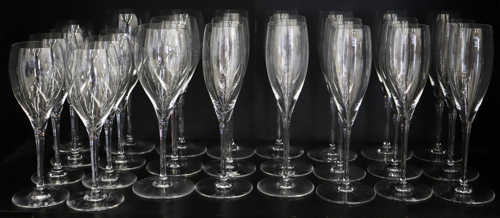 (26) BACCARAT WINE & CHAMPAGNE GLASSES: Baccarat Crystal 26 piece collection includes : Baccarat (15) Champagne flutes, 8 1/2", (4) red wine glasses 8 1/2", (7) white wine glasses 7 1/2". Marked Baccarat France .