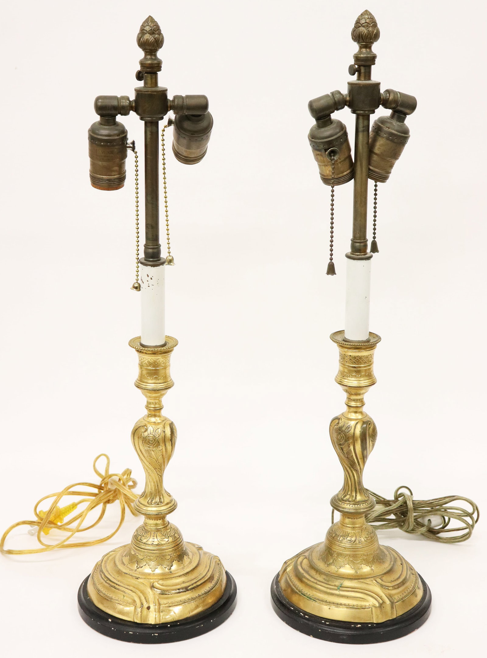 PAIR OF GILT ENGRAVED FRENCH NOUVEAU LAMPS: Pair of antique gold gilt lamps with engraved design. 22" tall 6" wide.