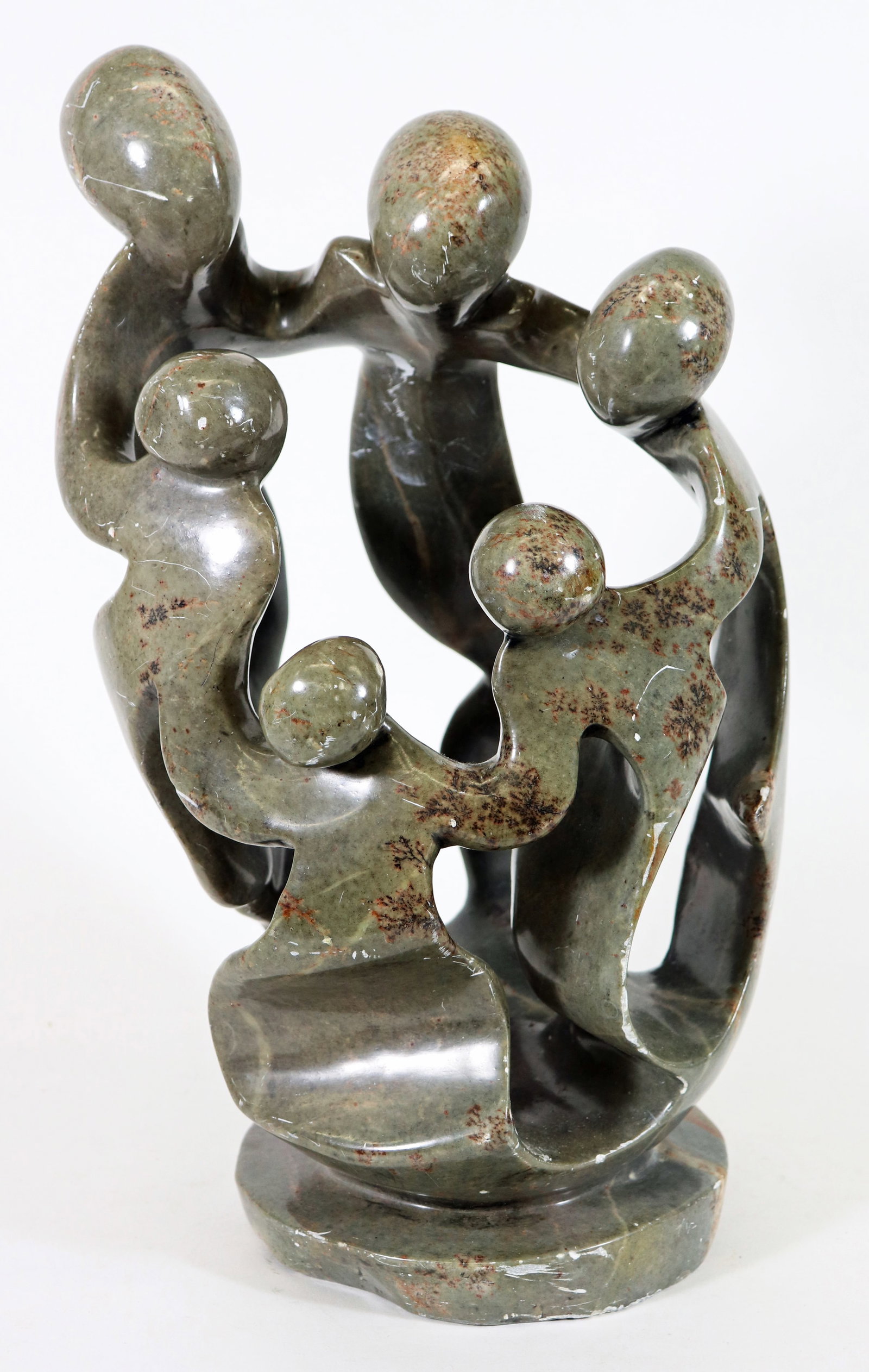 FAMILY CIRCLE SHONA AFRICAN STONE SCULPTURE - IGNATIUS TSUMBA: "Family Circle" African carved stone sculpture by artist Ignatius Tsumba. Some scratches & wear. Measures 16.5" tall 10.5" x 9" wide. Purchased in 2000 at Origins Gallery in Massachusetts for for $950