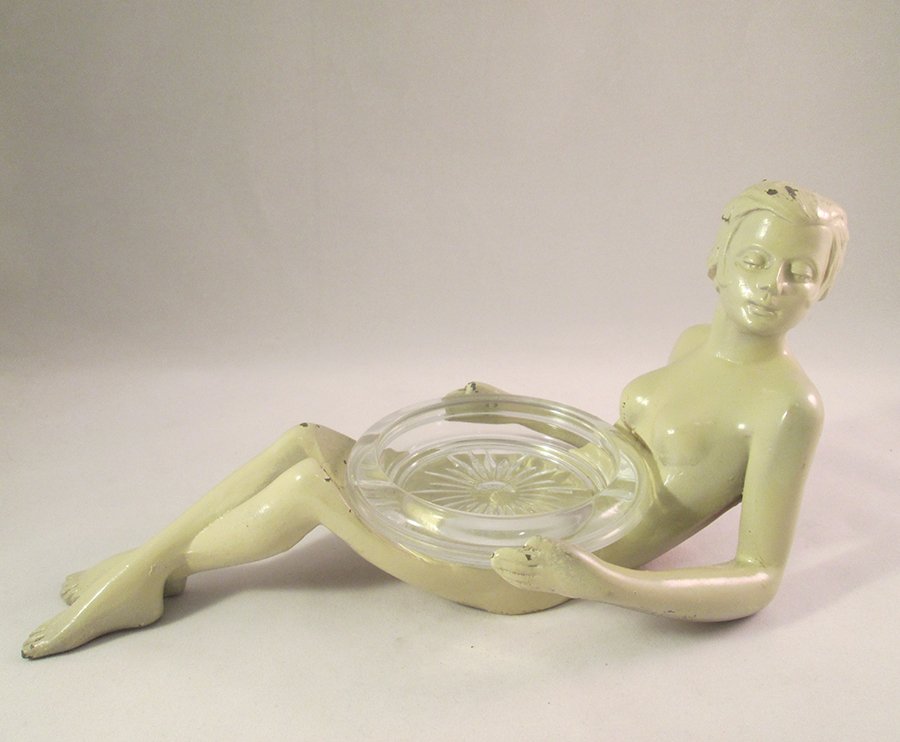 FIGURAL NUDE COASTER: Reclining nude female coaster, or ashtray, marked APT - NY No. 209. Measures 10" wide.