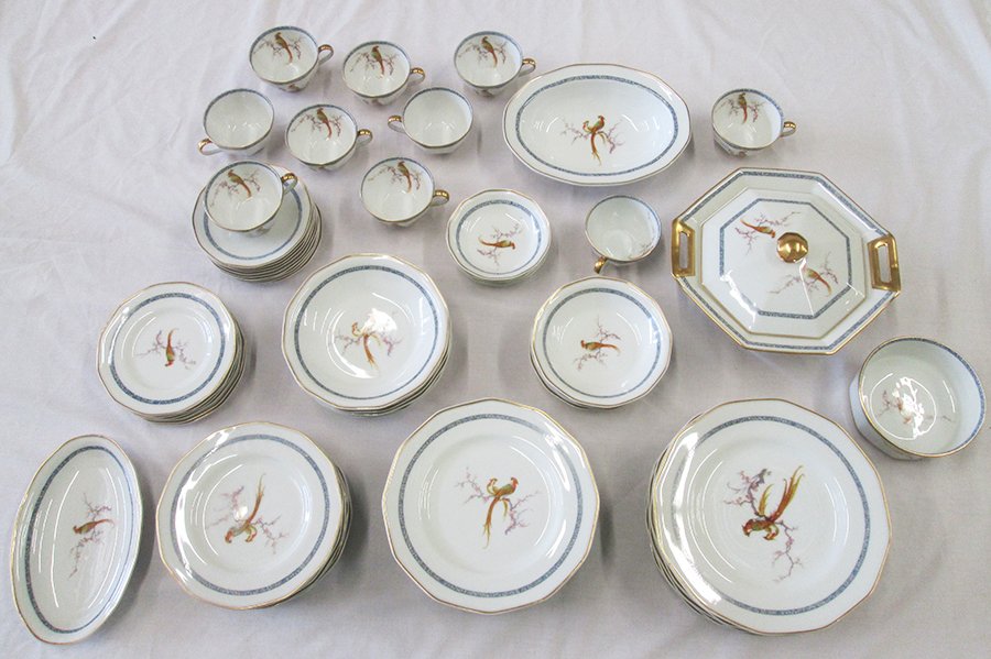 THEODORE HAVILAND LIMOGES CHINA SET W/ BIRDS: Beautiful 59 piece Limoges china set with bird of paradise design. Set includes (9) cups & saucers, (6) 6 3/8" plates, (5) berry bowls, (5) 6 1/4" bowls, (6) 9 3/4" dinner plates, (6) 7 1/2" soup bowl