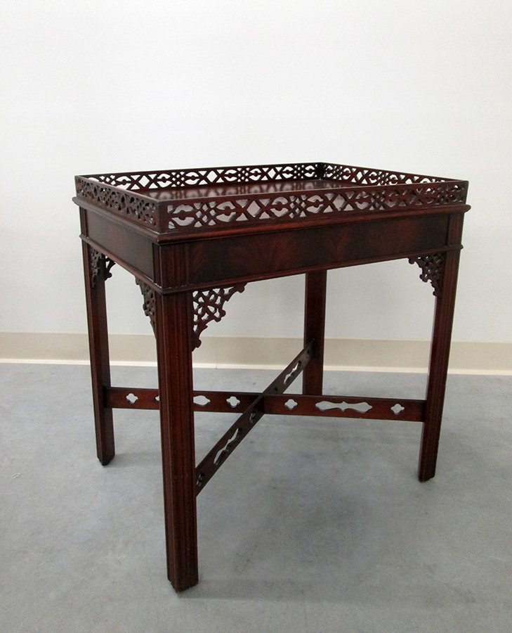 CHINESE CHIPPENDALE STYLE TEA TABLE: Mahogany tea table with Chinese Chippendale style reticulated design. Measures 25" tall 17" x 23" wide.