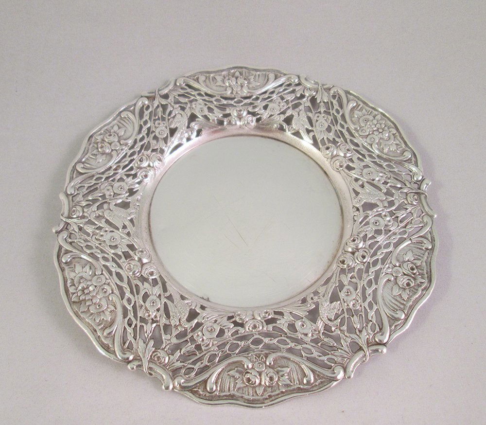 ANTIQUE HALLMARKED SILVER RETICULATED DISH: Beautiful silver dish or coaster with a reticulated flower and bird design. Hallmarks belived to be Hanau (Germany) Crown over P, RI in shield, and other unidentified mark. 5" wide 2.43 OZT.