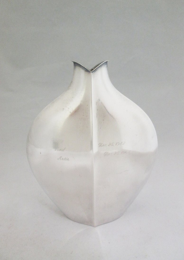 TAPIO WIRKKALA MODERN DESIGN STERLING VASE: Tapio Wirkkala (Finnish 1915-1985) Circa 1960's sterling silver vase. Signed TW on bottom with hallmarks 916H M7 Sterling Made in Finland. 6" Tall 6.44 OZT (200 grams). Monogrammed on front, given as 